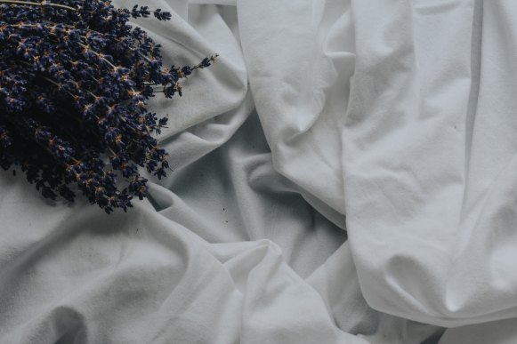 Lavender sprigs on sheets